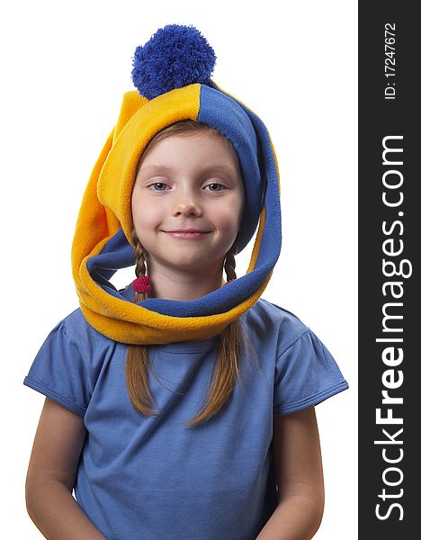 Little girl in the yellow-blue gnome cap isolated over white background. Little girl in the yellow-blue gnome cap isolated over white background