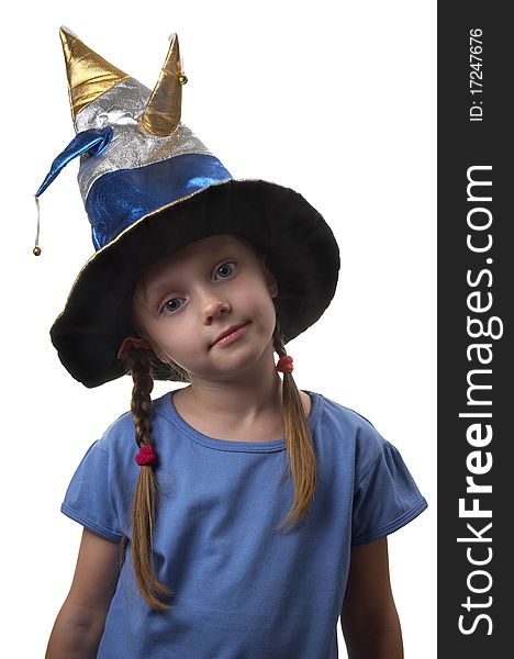 Little girl in the magic witch cap isolated over white background. Little girl in the magic witch cap isolated over white background
