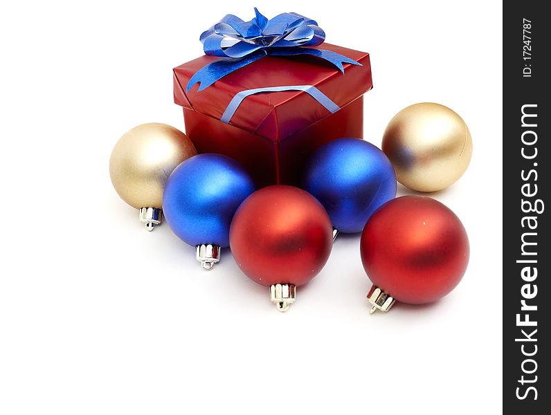 Matt christmas balls and a gift in red wrapping