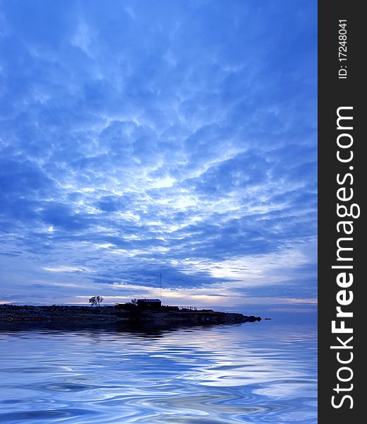 Sea and reflection in water during sundown