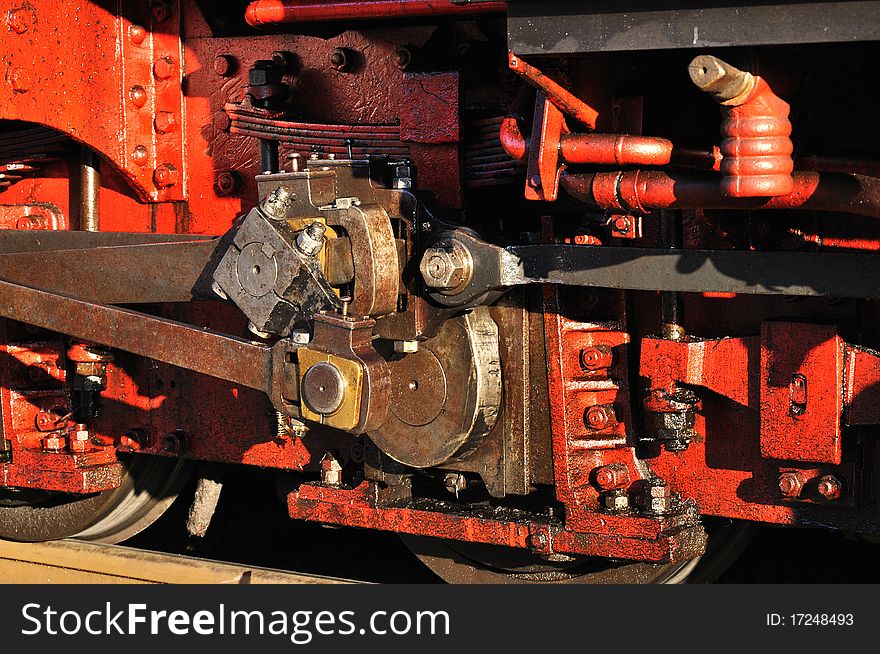 Closeup of vintage steam engine's, iron wheel