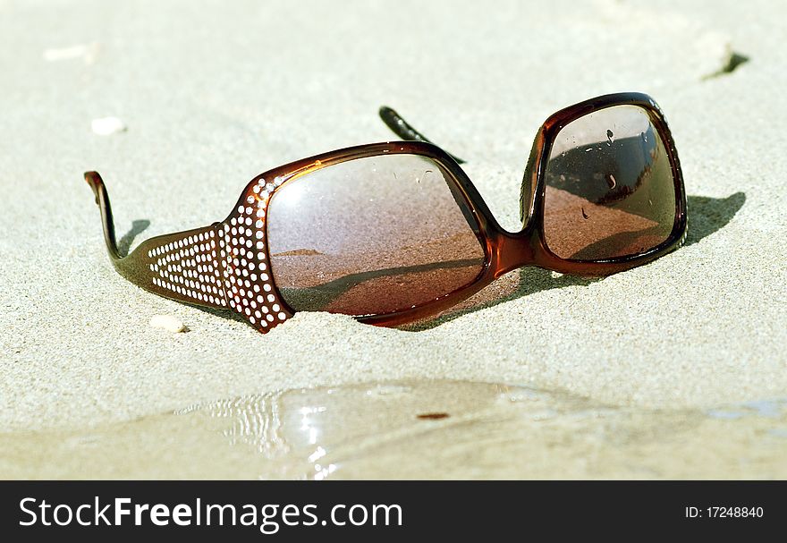 Sunglasses on the sand outdoor sea dae sunny