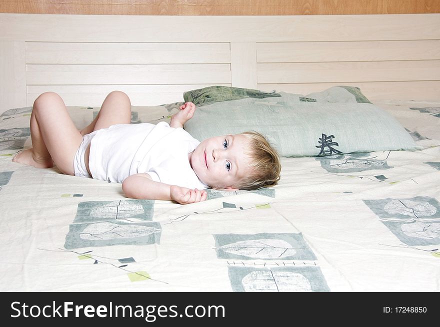 Cute child on parent's bed