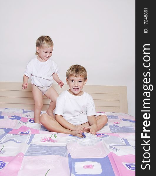 Two children on parent's bed