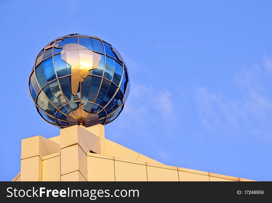 Globe on the roof over sky