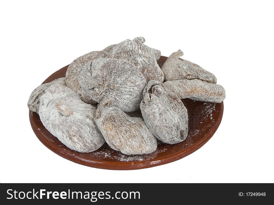 Dried figs in ceramic plate in isolated