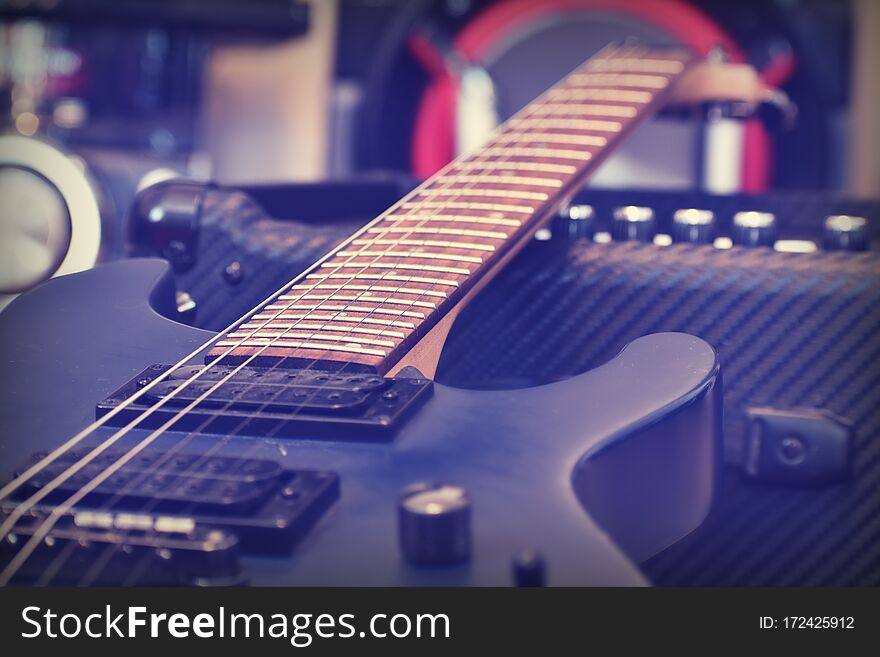 Electric guitar Wallpaper. Blur. Background music. Lessons of guitar playing. String melody. the strings of a musical instrument