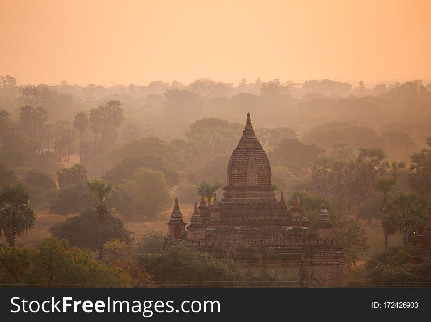 Sunrise over the valley with the ancient pagodas in Bagan