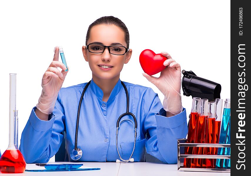 The young female doctor in lab isolated on white