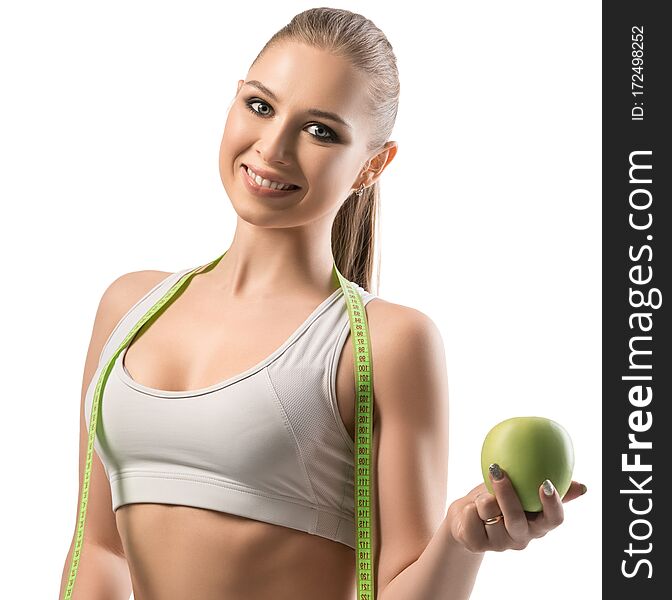 Fitness trainer with an apple and tape-measure
