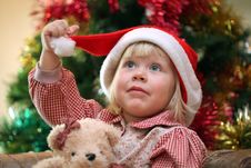 Small Girl With Toy Near Christmas Tree Stock Image Small Girl With Toy Near Christmas Tree Stock Image