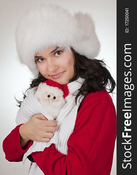 Young female and her santa claus. shooted in studio. Young female and her santa claus. shooted in studio
