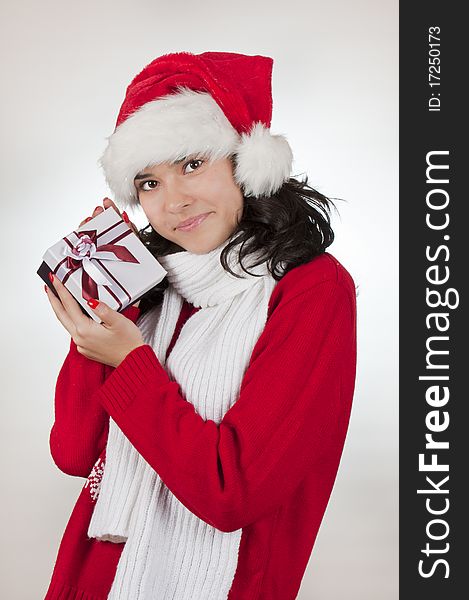 Young female and christmas gift. shooted in studio