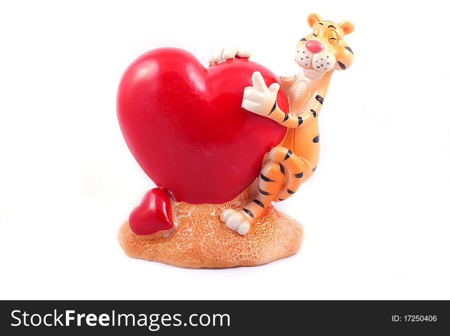 Funny toy of a heart and tiger isolated on white background.