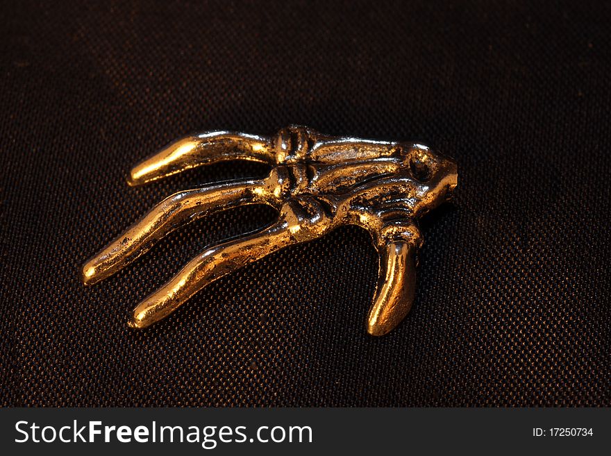 Hand with four fingers of metal