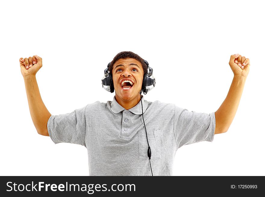 Young happy man listening to music and singing