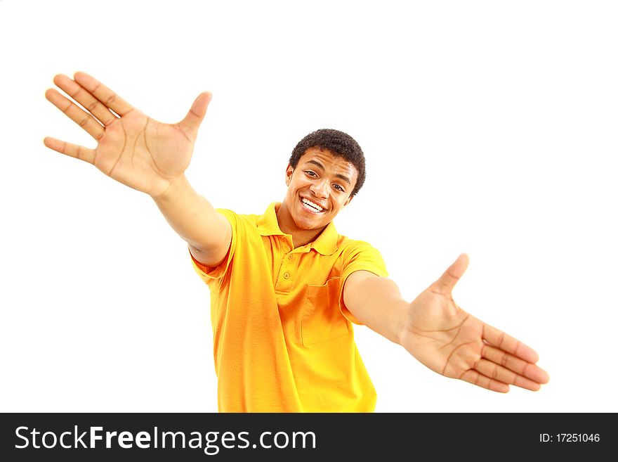 Success sign - A young man showing thumbs up sign over white background