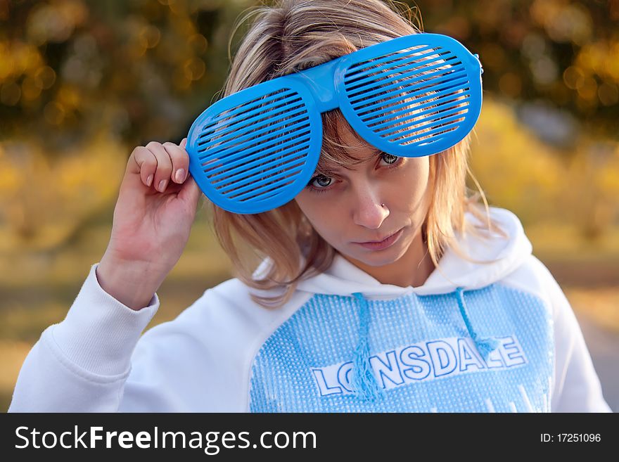 Portrait of a beautiful young woman with a big funny glasses. Portrait of a beautiful young woman with a big funny glasses