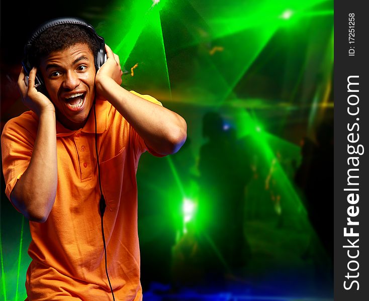 Boy is is listening to music in nightclub