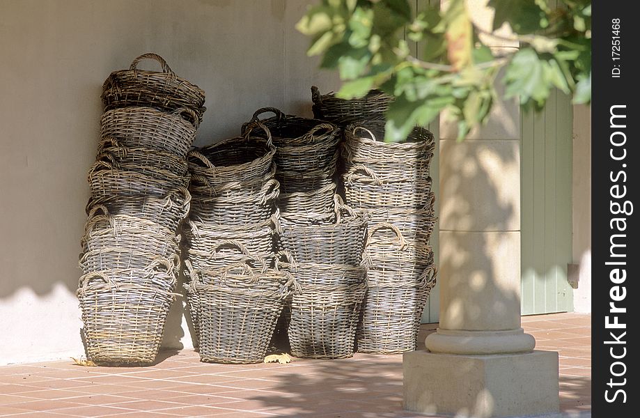 Baskets on the terras of a house.