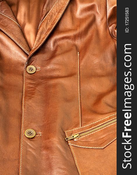 Detail of clothing and leather in brown. Detail of clothing and leather in brown