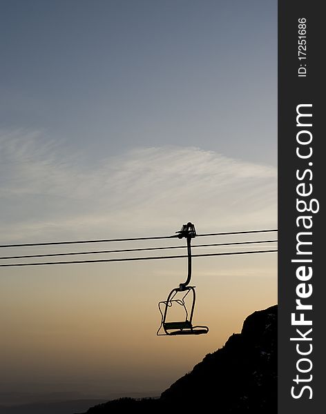 Chairlift in autumn at the sunset. Chairlift in autumn at the sunset