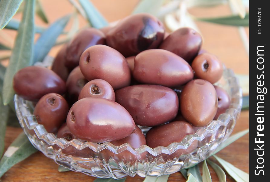 Black Olives on a wooden table