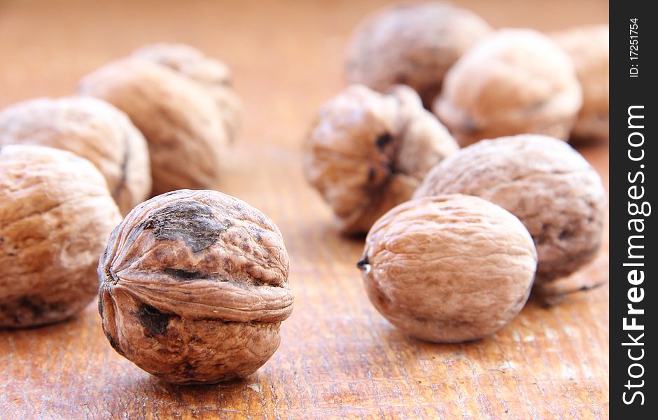 Macro view of walnut on a wooden structure