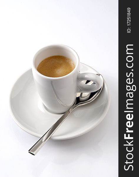 Presentation of a coffee with spoon.