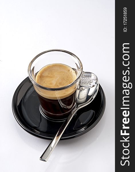 Presentation of a coffee with spoon.