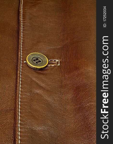 Detail of clothing and leather in brown. Detail of clothing and leather in brown