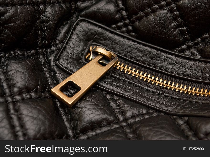 Close shot of leather bag zipper