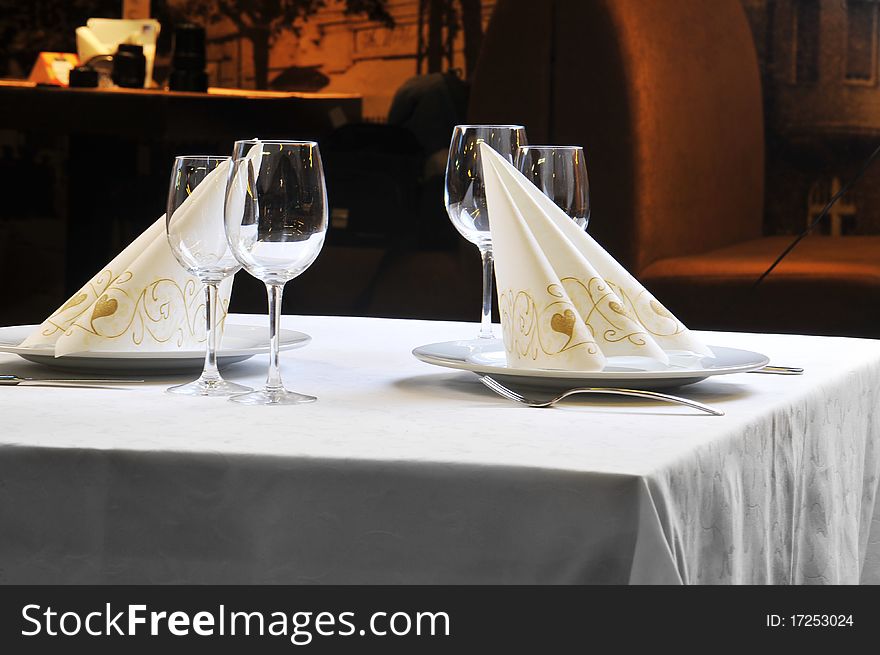 Tables set for  meal in  modern  restaurant