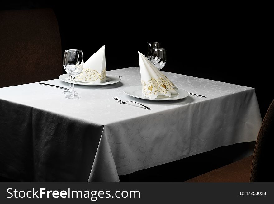 Tables set for meal in modern restaurant. Tables set for meal in modern restaurant