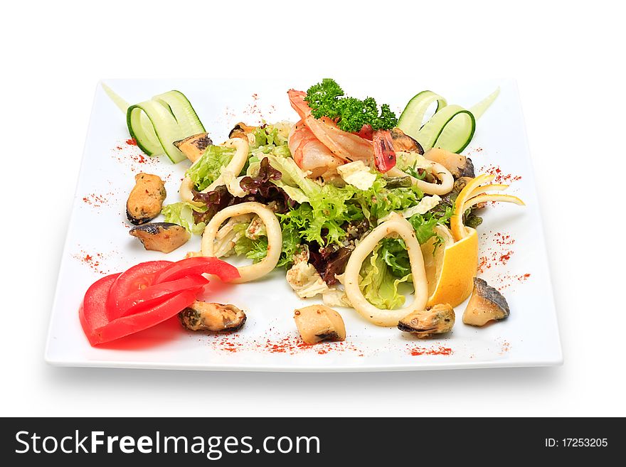 Seafood with vegetables and herbs on a ceramic platter. Seafood with vegetables and herbs on a ceramic platter