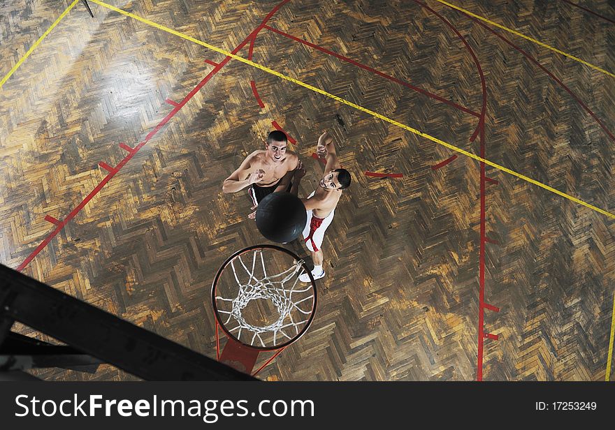 Young and healthy people man have recreation and training exercise while play basketball game at sport gym indoor hall. Young and healthy people man have recreation and training exercise while play basketball game at sport gym indoor hall