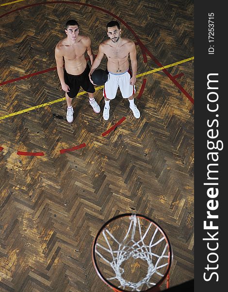 Young and healthy people man have recreation and training exercise while play basketball game at sport gym indoor hall. Young and healthy people man have recreation and training exercise while play basketball game at sport gym indoor hall