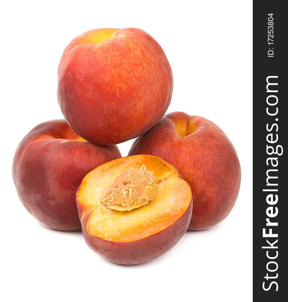 Close-up heap of ripe peaches, isolated on white