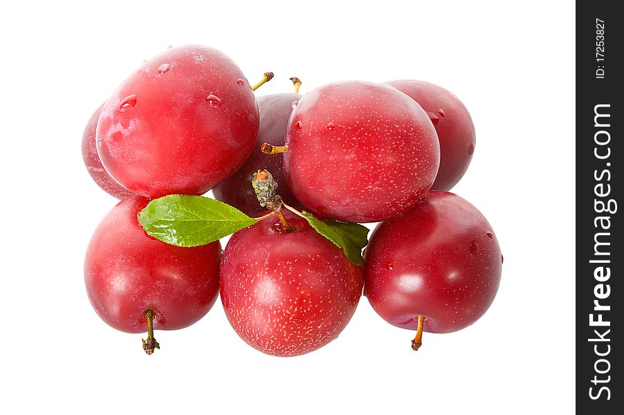 Wet ripe plums, isolated on white