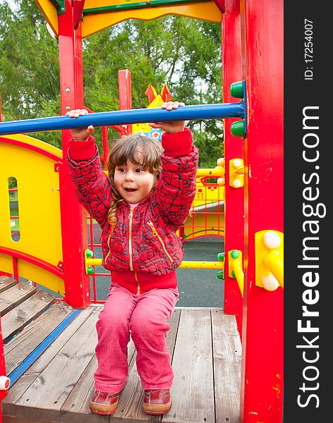 Little Girl Plays In Playground