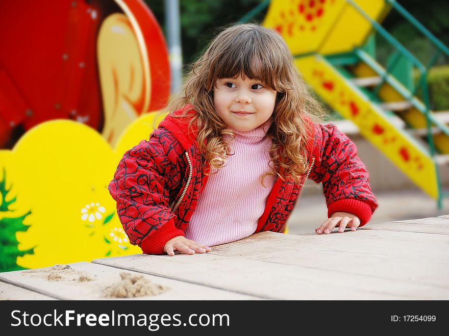 Little girl portrait in playground in a park