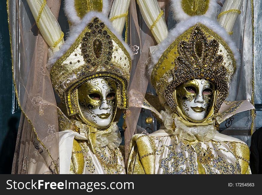 Carnival of Venice couple of goldne mask on the place of san marco. Carnival of Venice couple of goldne mask on the place of san marco