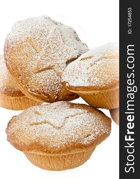 Close up of mince pies with icing sugar dusting on white isolated background