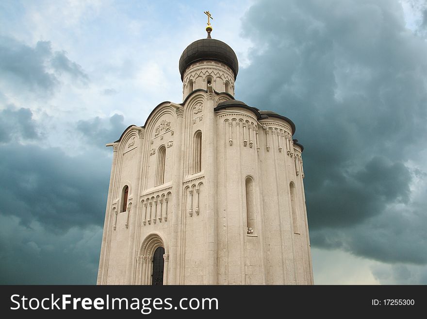 The image of ancient church photographed against the sky