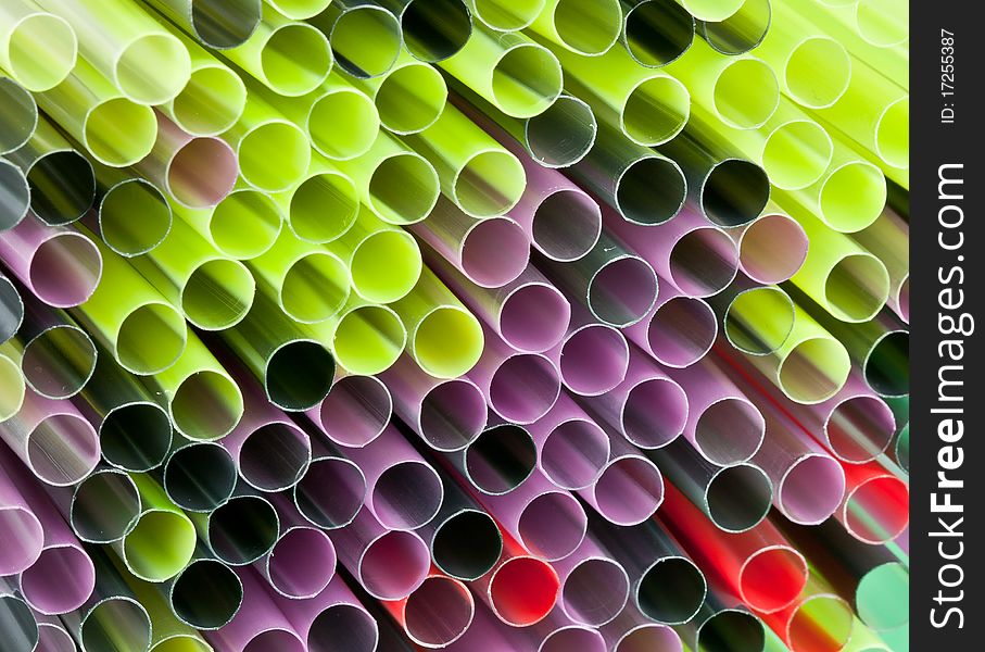 Colorful straws in a bunch set as a background. Colorful straws in a bunch set as a background