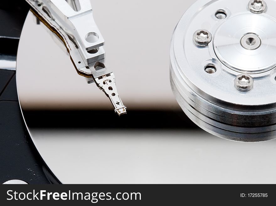 Closeup of open harddrive with white reflection. Closeup of open harddrive with white reflection