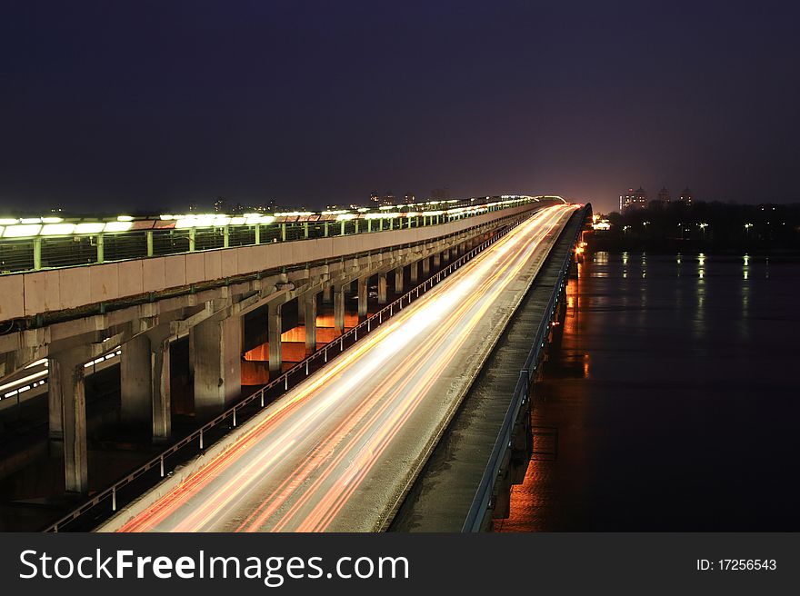 Movement of vehicles on the bridge at night. Movement of vehicles on the bridge at night