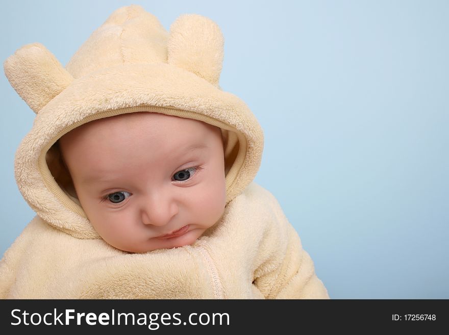 Two month old baby boy wearing a soft animal suit