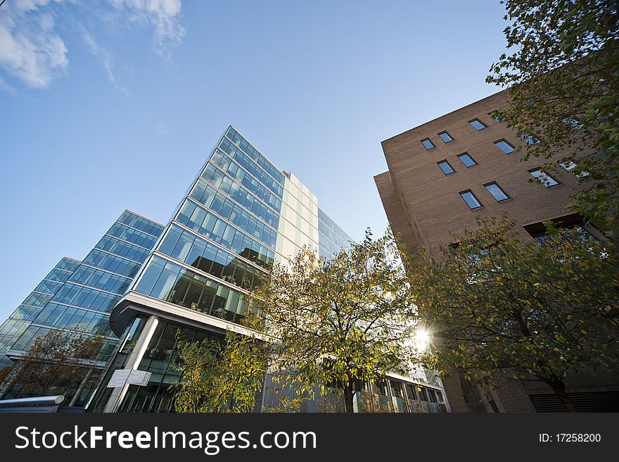 Modern buildings in london with clouds