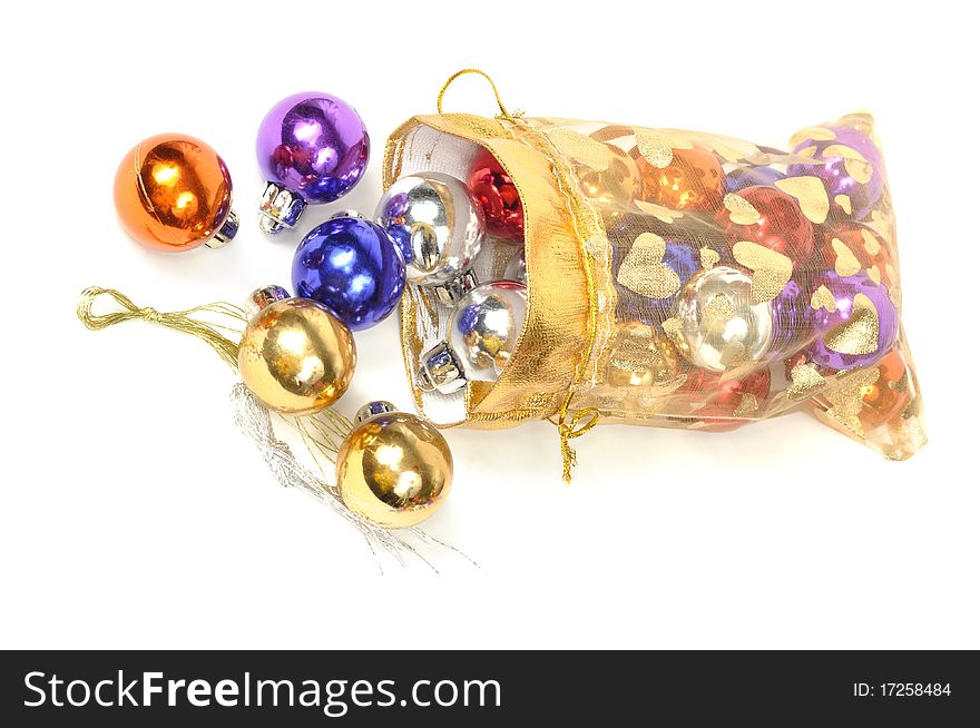 Christmas colorful balls in golden bag, on white. Christmas colorful balls in golden bag, on white